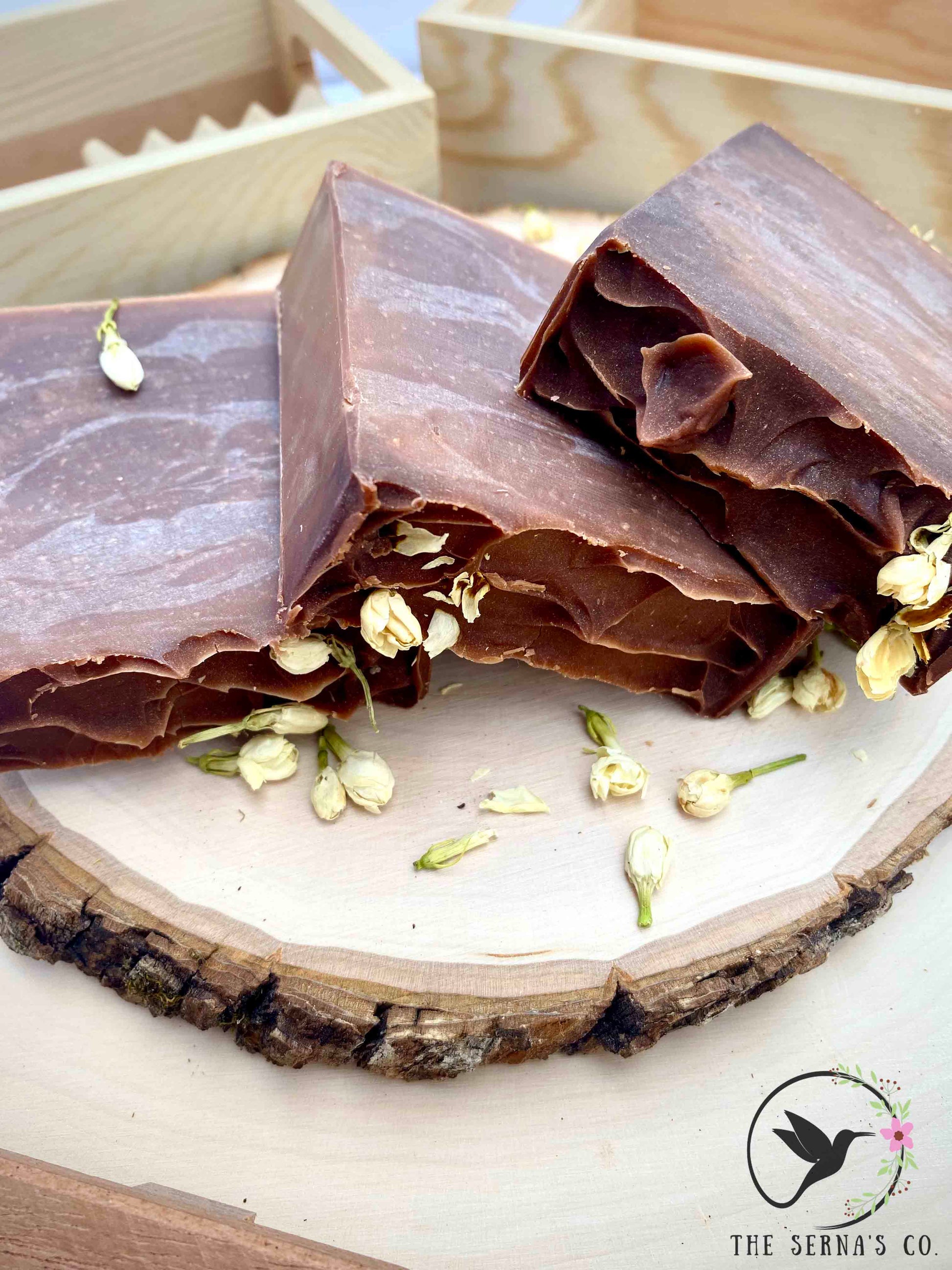 Soap bars displayed on wood with ingredients 